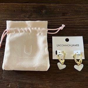 Uncommon James - gold hoops with white heart embellishment